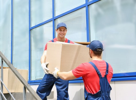 Packers and movers handling boxes and furniture for a local move