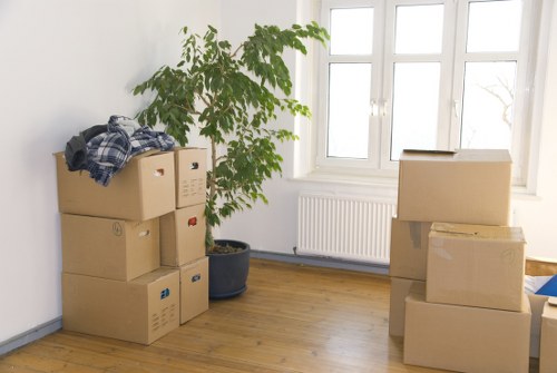 Local removalists unloading boxes at a Motspur Park property