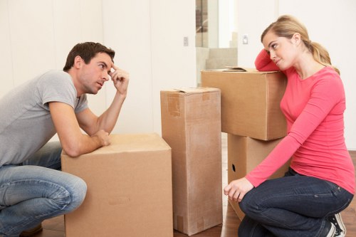 Removal van and packed boxes outside a suburban Motspur Park home