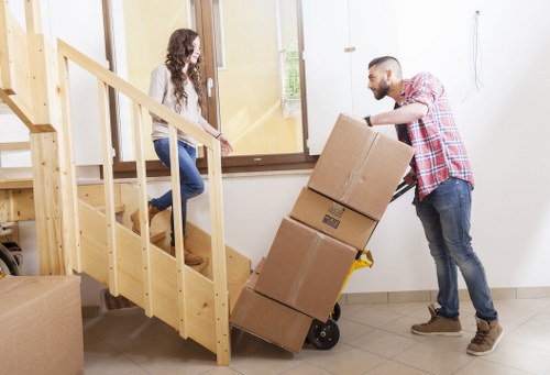 Removal team loading household items for a Motspur Park relocation