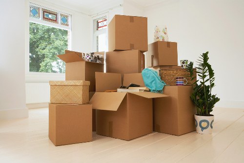 Local removal team handling office items with a moving truck in Motspur Park