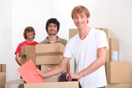 Professional movers handling a family home relocation near Motspur Park